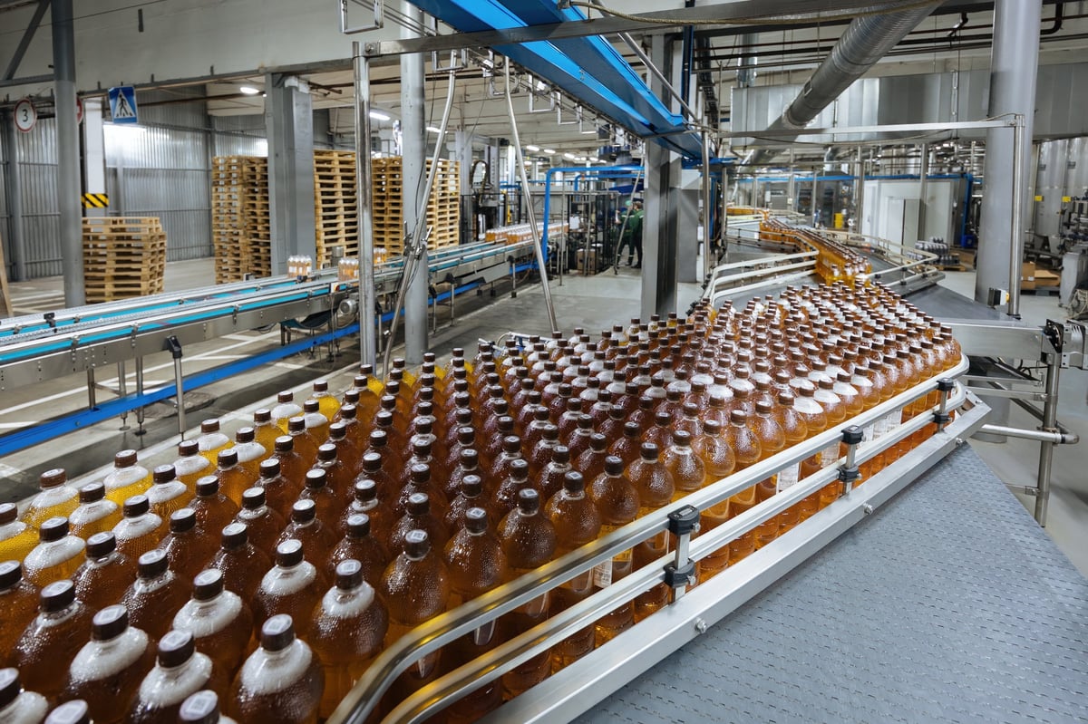 Automated production line filling and packing product in a modern food manufacturing facility